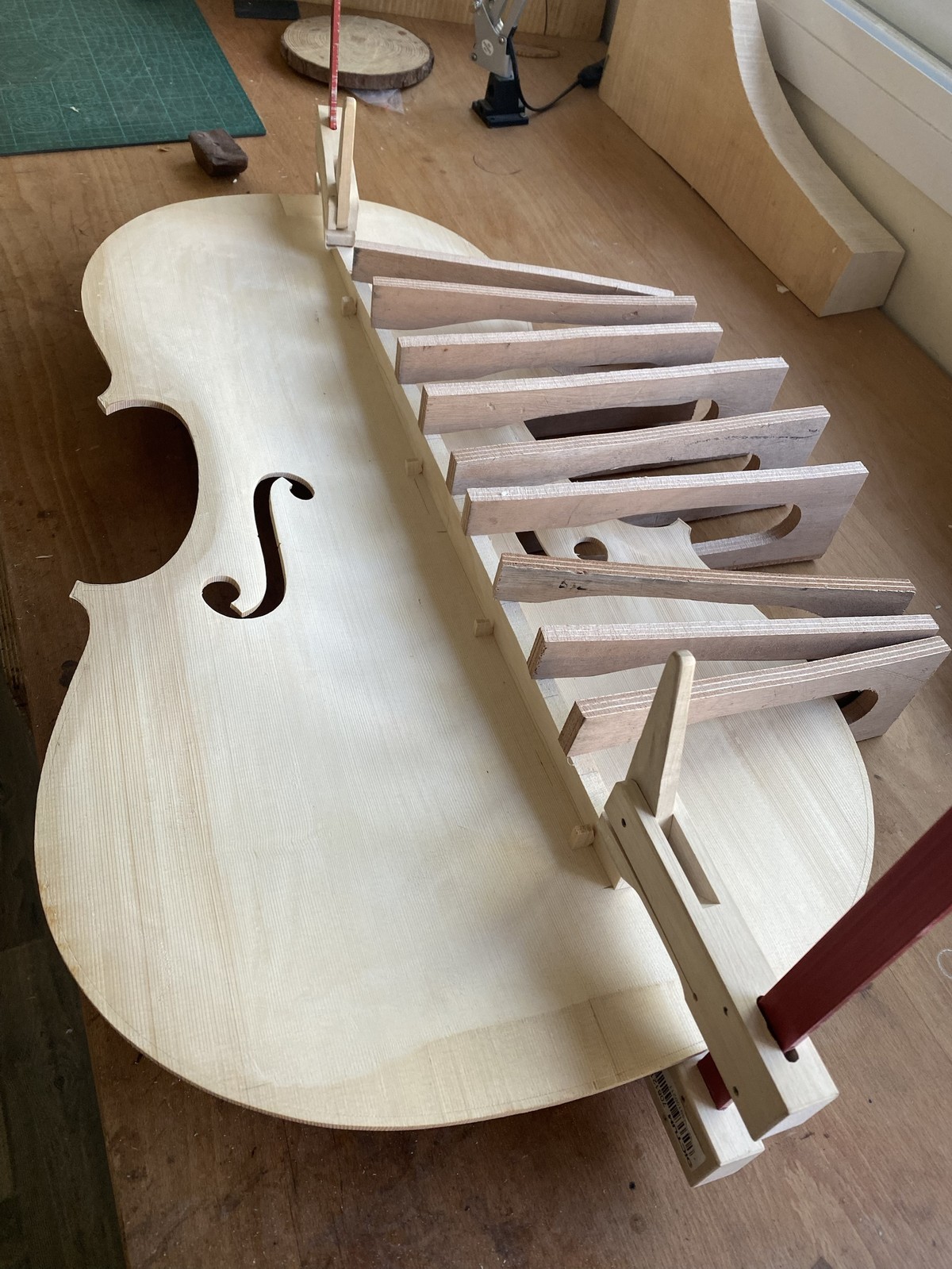 Gluing the linings onto the cello top