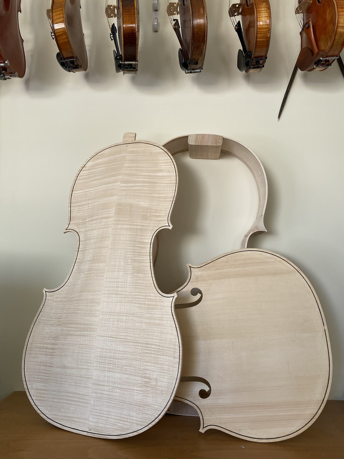 The finished white cello back and front before varnishing