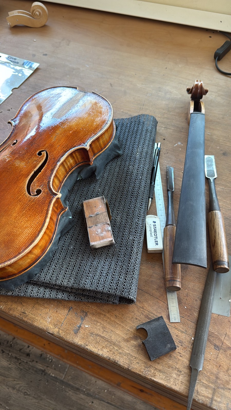 A finished violin, resting after the final touches