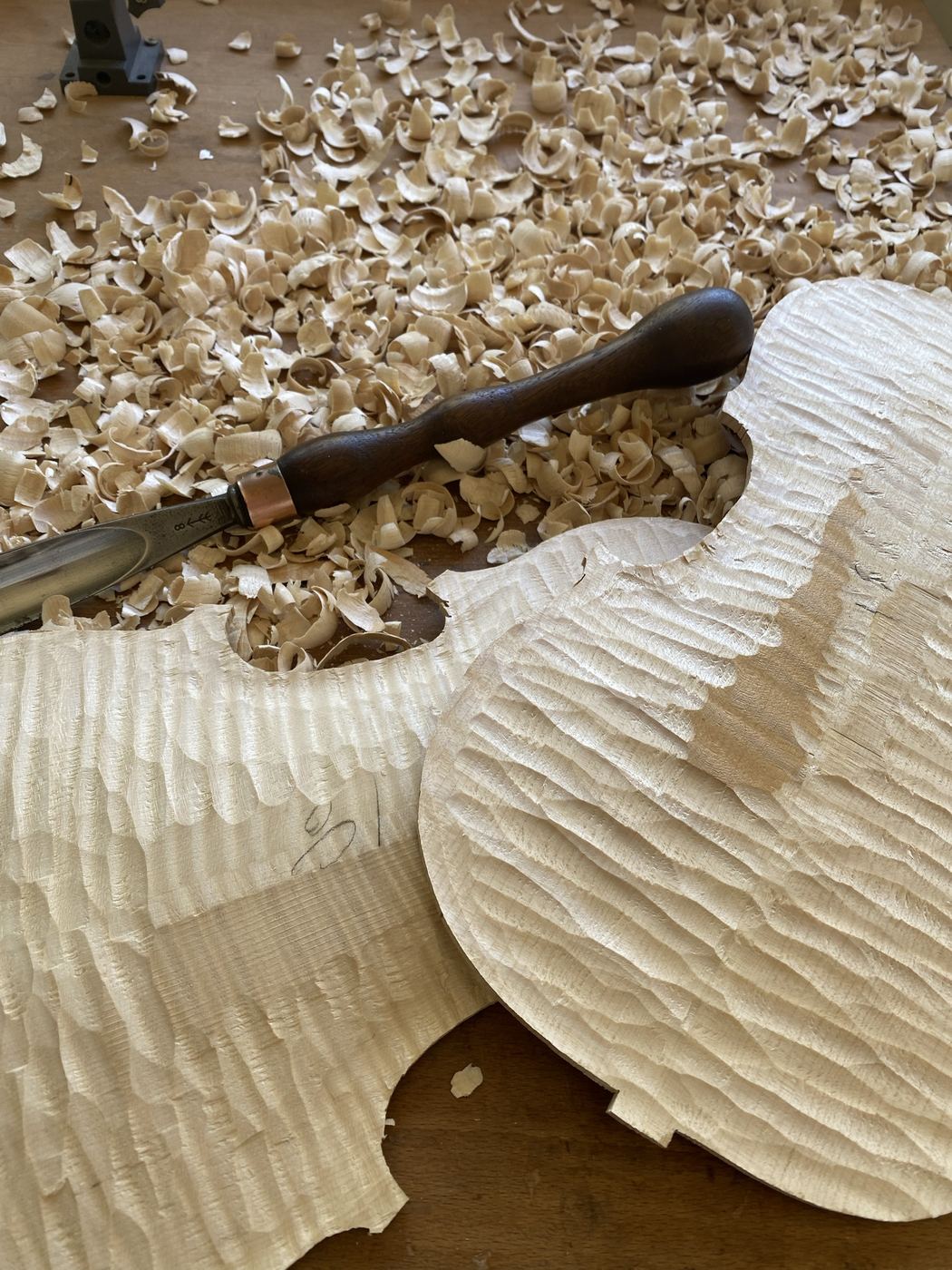 Roughing out the arching of viola plates with a gouge